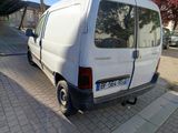 a white van that is parked on the side of the street