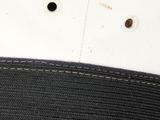 a close up of a hat with a gold buckle on it