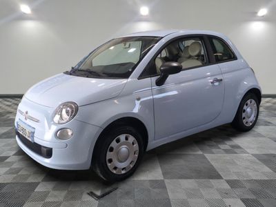 a picture of a small white car on a checkered floor