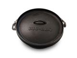 an old cast iron skillet with a lid on a white surface