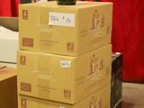 boxes stacked on top of each other with a bottle of wine on top of them