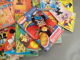 a pile of children ' s books on a table