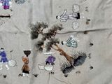 a picture of a cloth with a picture of people on it