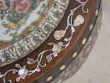 a close up of a decorative table with flowers on it