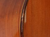 an image of a close up view of a wooden guitar