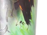 a vase with a picture of a horse and a bird on it