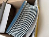 a cardboard box with a bunch of plates in it