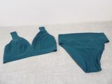 the two pieces of underwear are laying on the bed