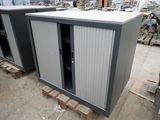 two cabinets that are sitting in a warehouse