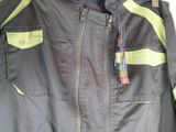 a black jacket with a yellow zipper on it