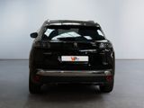 a picture of a black car parked in a garage