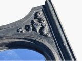 a picture of a mirror that is on the side of a building