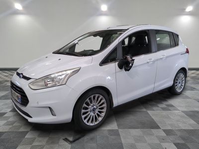 the white ford c - max is parked on a checkered floor