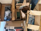many boxes of electronic equipment sitting on the floor