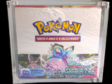 a box of pokemon trading cards on a black background