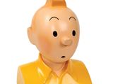 une tête d'homme en plastique jaune, portant une chemise jaune