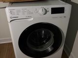 a washer and dryer in the corner of a room