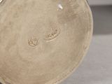 a close up of a vase on a table