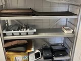 a room with a lot of shelves and boxes on the floor