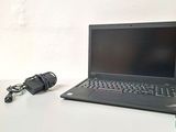 a laptop computer sitting on a table with a microphone