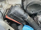 a car engine with a dirty air filter in it