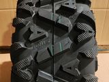 a close up of a tire on a cardboard box