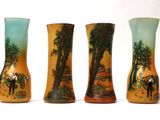 three vases that are sitting side by side on a white surface
