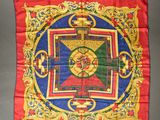 a close up of a red and blue square with a cross on it