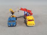 two toy cars that are sitting next to each other