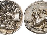 a silver coin with an image of a lion on it