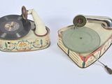 two old record players sitting next to each other on a table