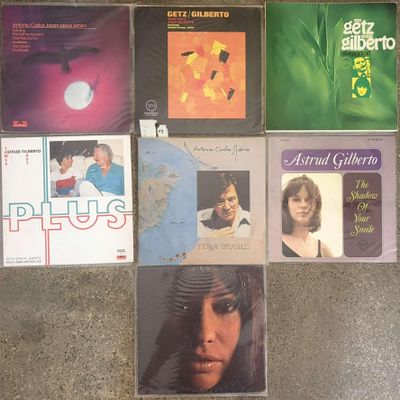 various album covers on the floor of a room