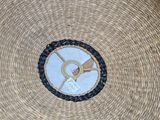 a wicker basket with a picture of a bird on it