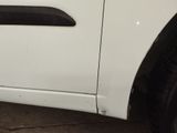 a close up of a car door handle with a sticker on it