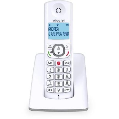 une image représentant un téléphone sans fil blanc posé sur un socle blanc