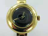 an image of a gold wrist watch with a black dial on a white background