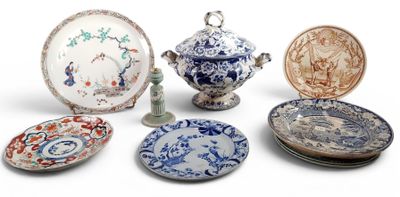 many different types of plates and bowls on the table