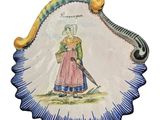 a plate with a picture of a woman on it