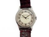 a close up of a wrist watch on a white background