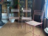 two chairs and a table in a room with a fireplace