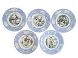 four blue and white plates with pictures of people on them
