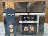an air fryer in a box on a bed with a wooden background