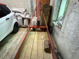 a car that is parked in a garage next to a ladder