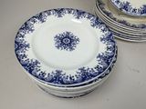 several blue and white plates are stacked on top of each other
