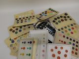 a lot of different colored buttons on a white surface