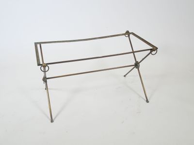 a metal table that has a metal frame on it