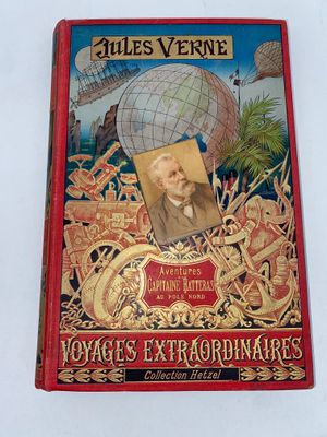 an old red book with a picture of a man on it