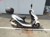 a scooter that is parked in a parking lot