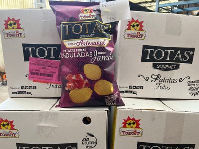 several boxes of potato chips are stacked on top of each other