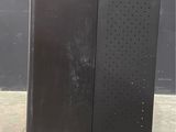 a black refrigerator that is sitting on the concrete floor